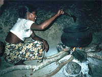 A traditional three stone fire in use in a Sri Lankan home